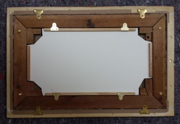 An example of a removable solid insert to protect paintings in transit