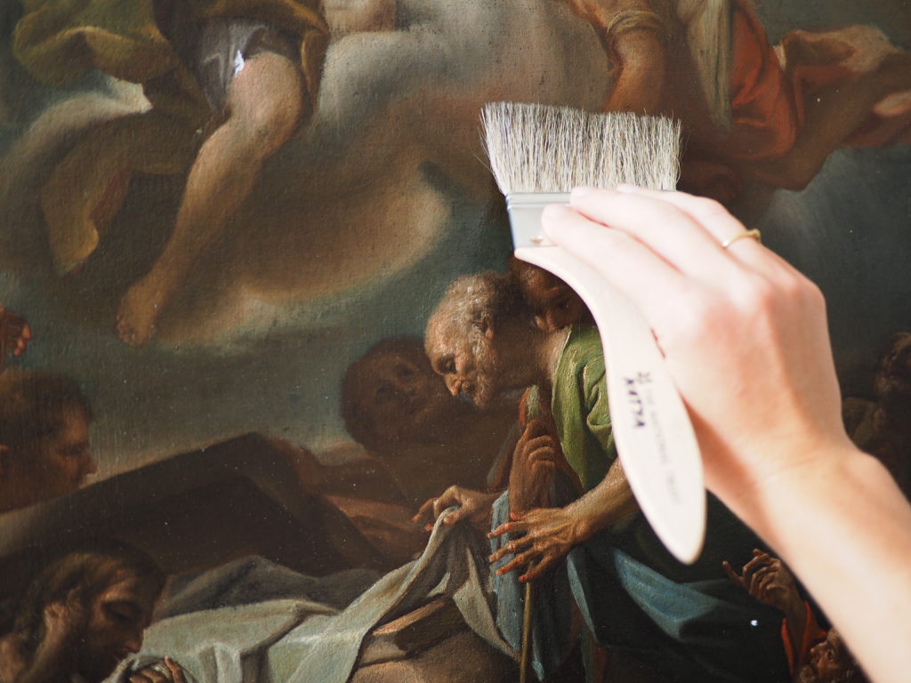 Dusting of paintings with a soft pony hair brush